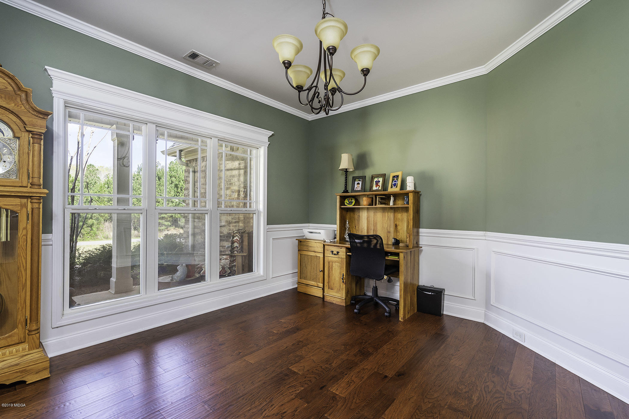 125 Rivers Edge Drive Forsyth, GA 31029 - Photo 4 of 21 a view of a room with workspace wooden floor and windows