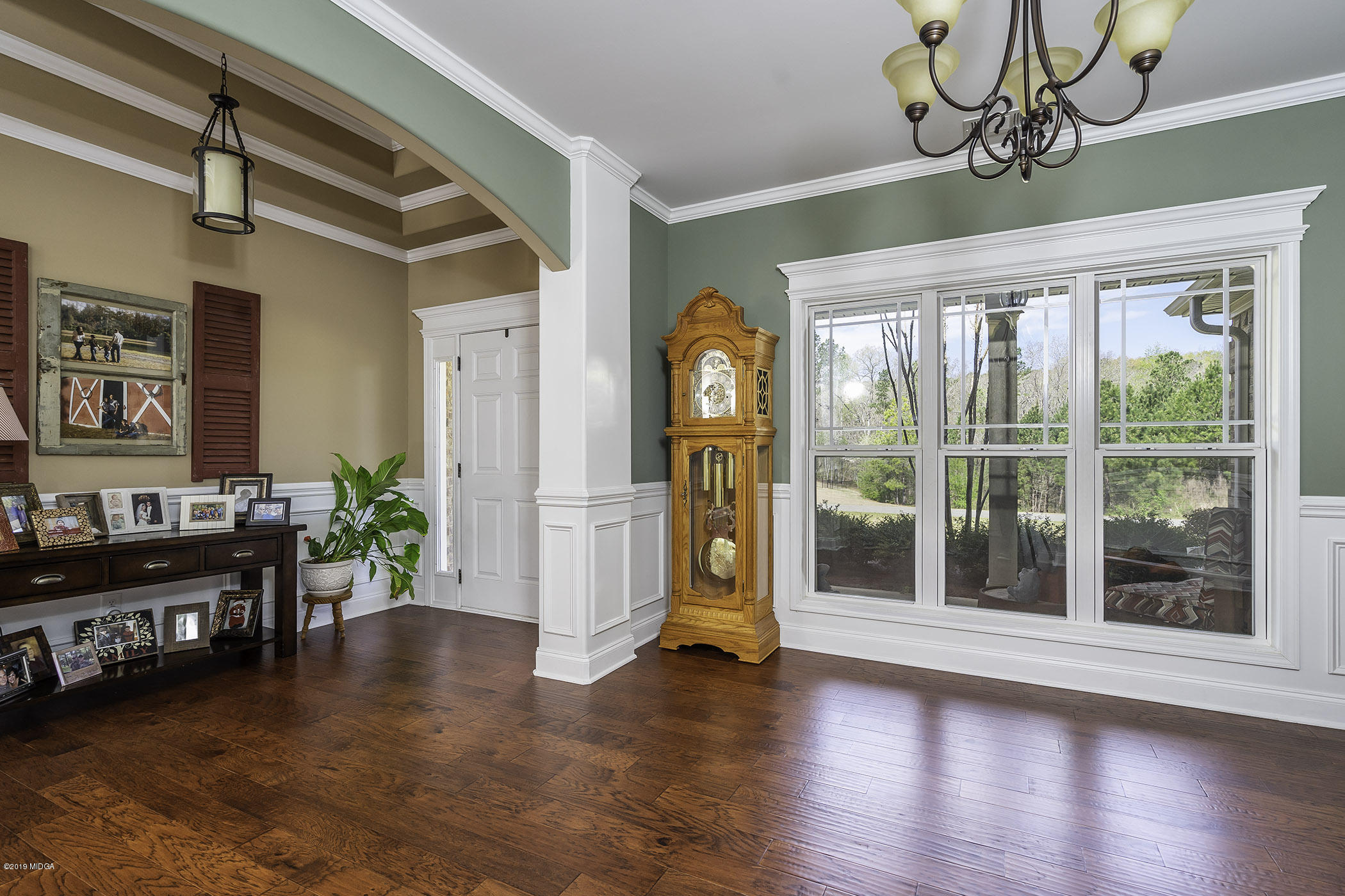 125 Rivers Edge Drive Forsyth, GA 31029 - Photo 5 of 21 a view of an entryway with wooden floor and windows