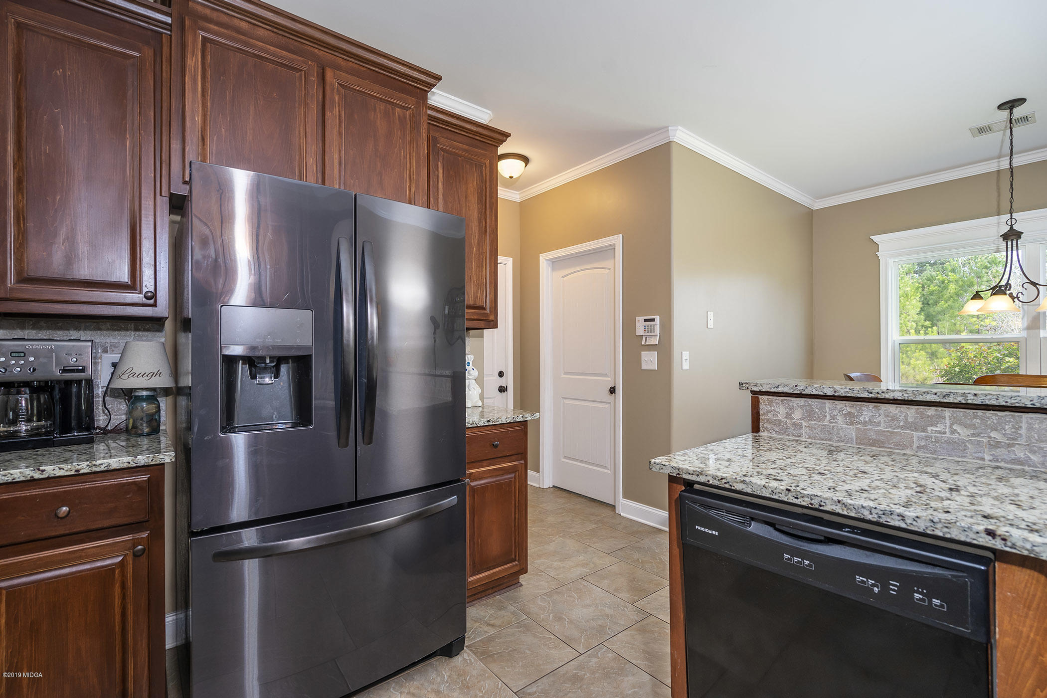 125 Rivers Edge Drive Forsyth, GA 31029 - Photo 8 of 21 a kitchen with stainless steel appliances granite countertop a refrigerator and a sink