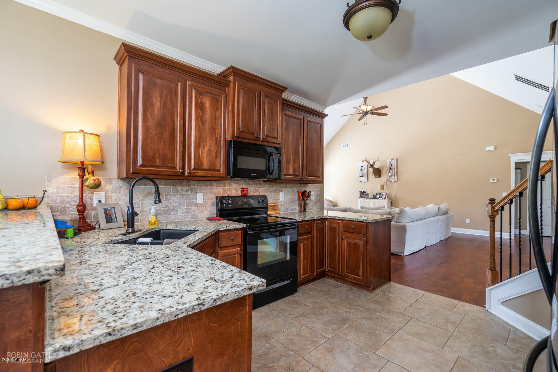 125 Rivers Edge Drive Forsyth, GA 31029 - Photo 10 of 21 a kitchen with stainless steel appliances granite countertop a sink stove and refrigerator