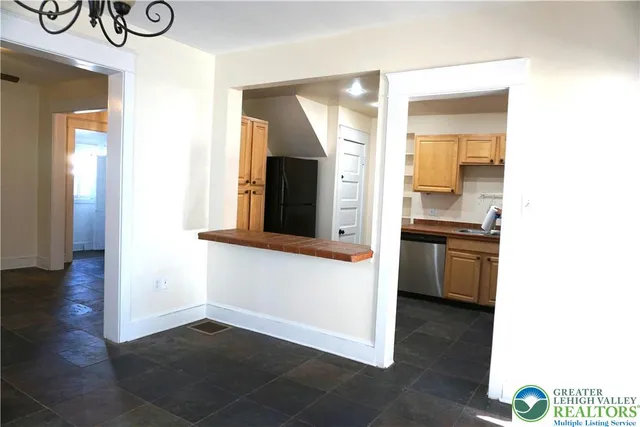 a view of a kitchen from the hallway