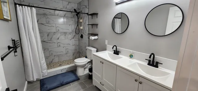a view of a dining room with furniture and a window