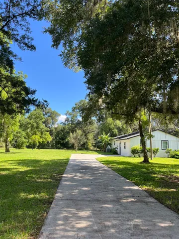 a bathroom with a toilet a sink and a mirror