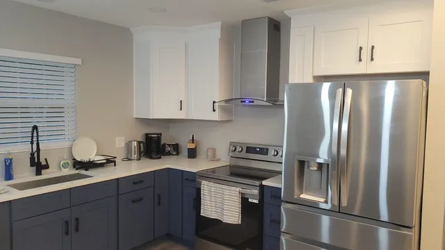 a kitchen with a sink cabinets and window