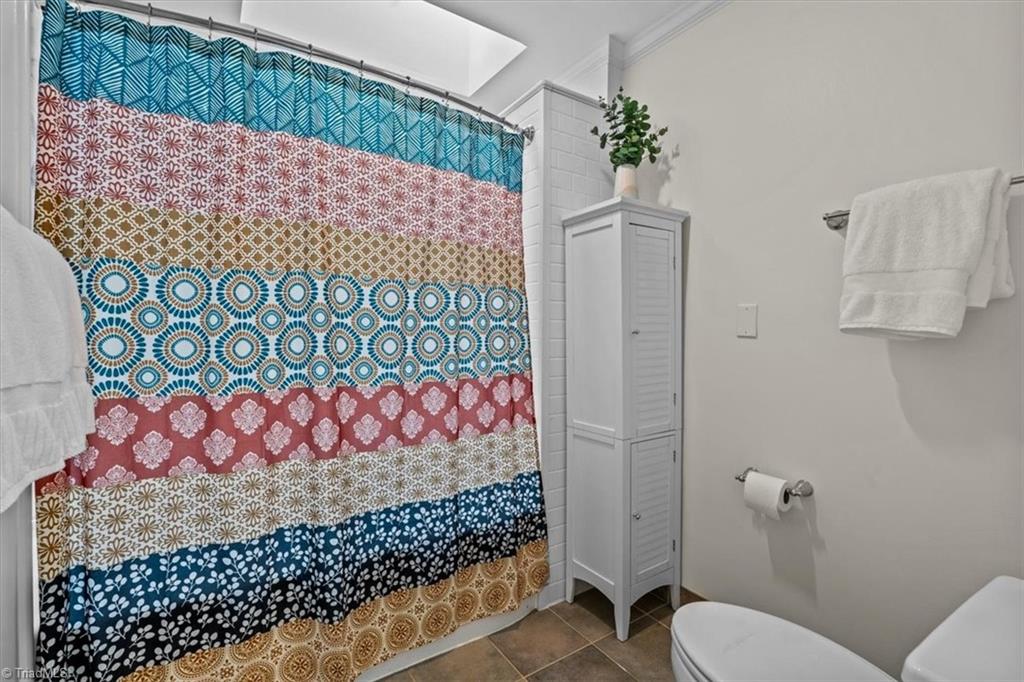 1608 Fox Hollow Road Greensboro, NC 27410 - Photo 20 of 44 Skylight above primary shower/tub combination