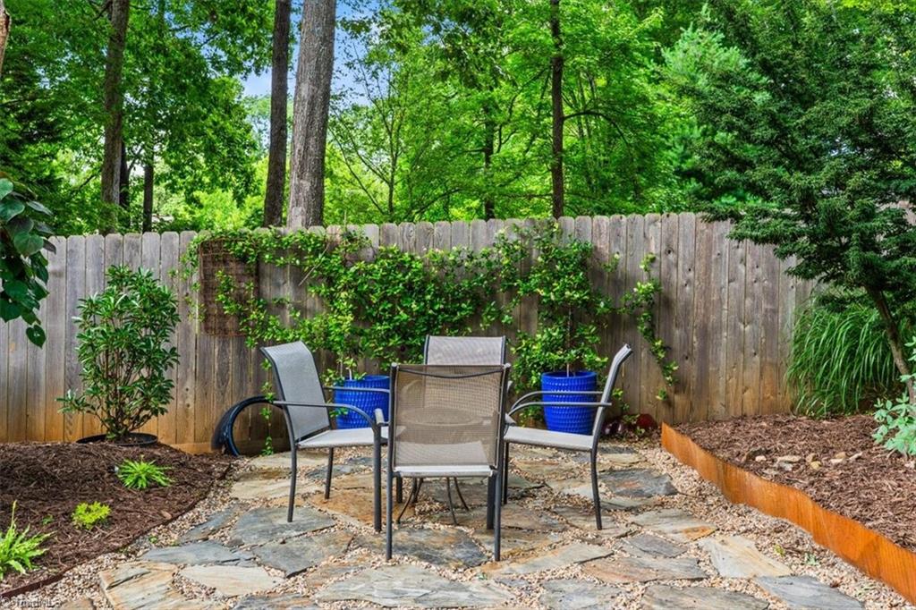 1608 Fox Hollow Road Greensboro, NC 27410 - Photo 34 of 44 Outdoor Dining with privacy fence