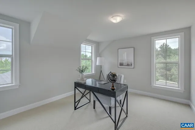 a work room with furniture and windows