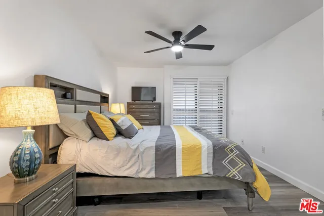 a bed room with a bed and window