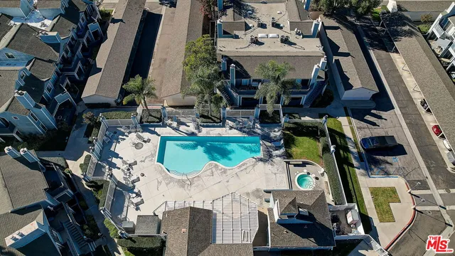 an aerial view of a house with outdoor space