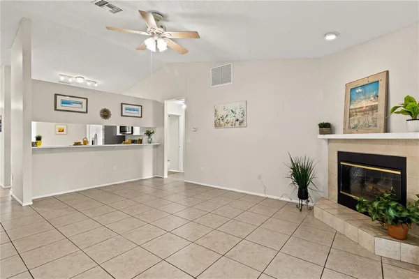a view of a kitchen with furniture and a fireplace
