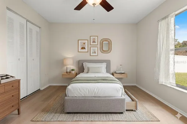 a bedroom with a bed and a window