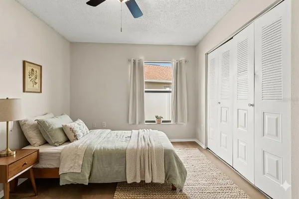a bedroom with a bed and a window