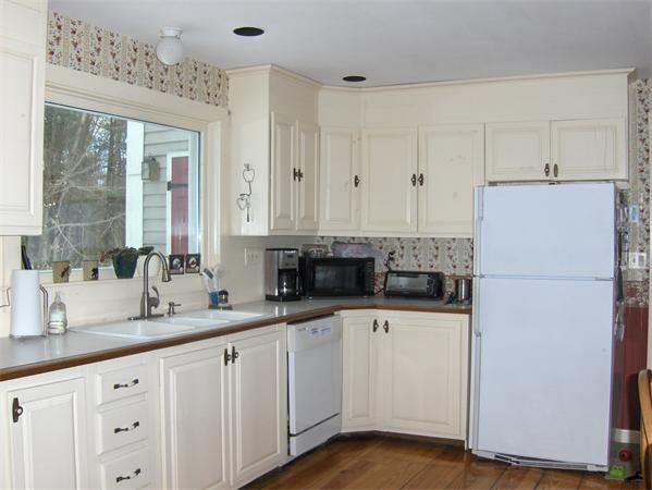 142 Hubbardston Road Princeton, MA 01541 - Photo 5 of 30 a kitchen with sink a refrigerator and white cabinets