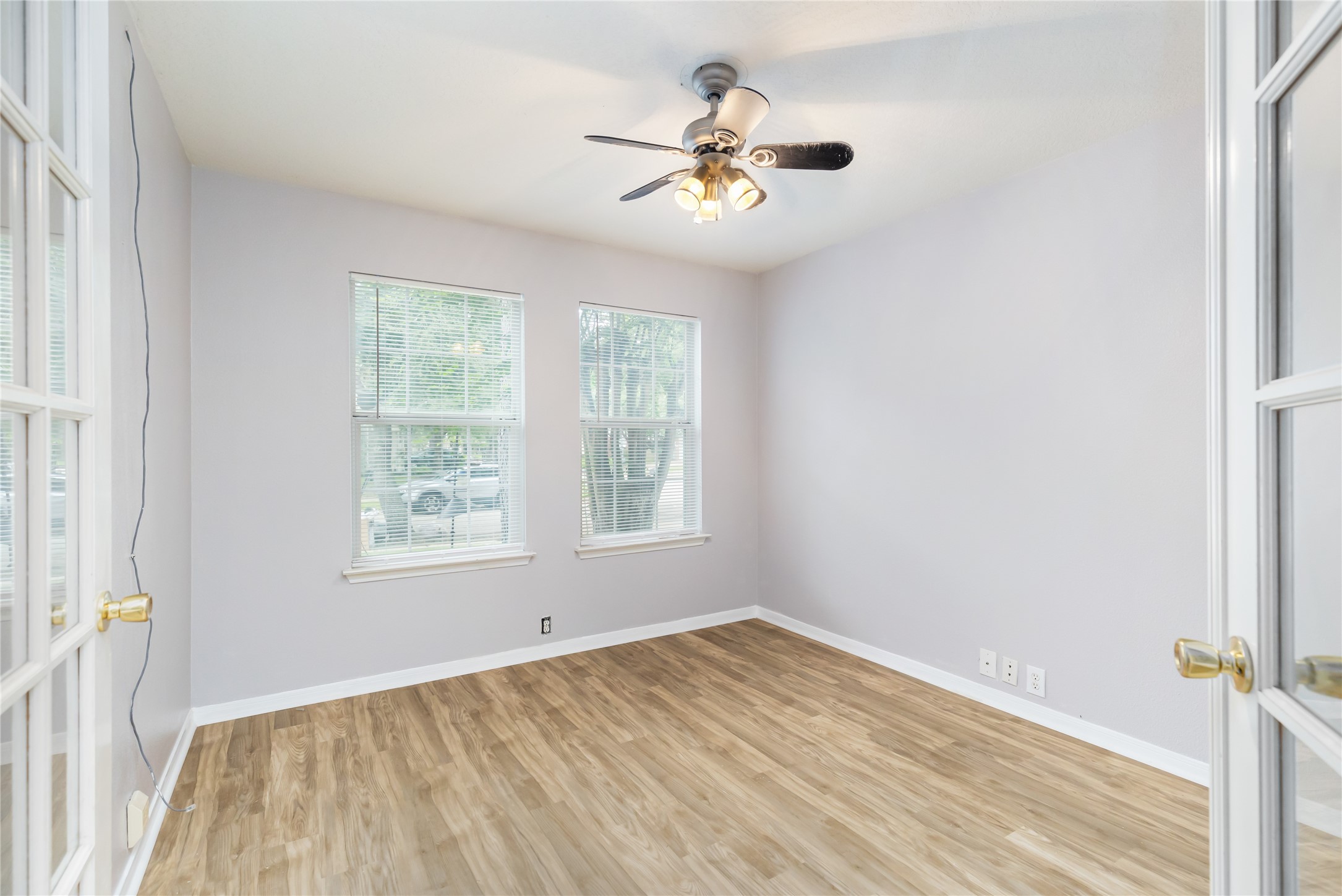 17334 Turquoise Stream Drive Houston, TX 77095 - Photo 13 of 31 an empty room with a window and a chandelier fan