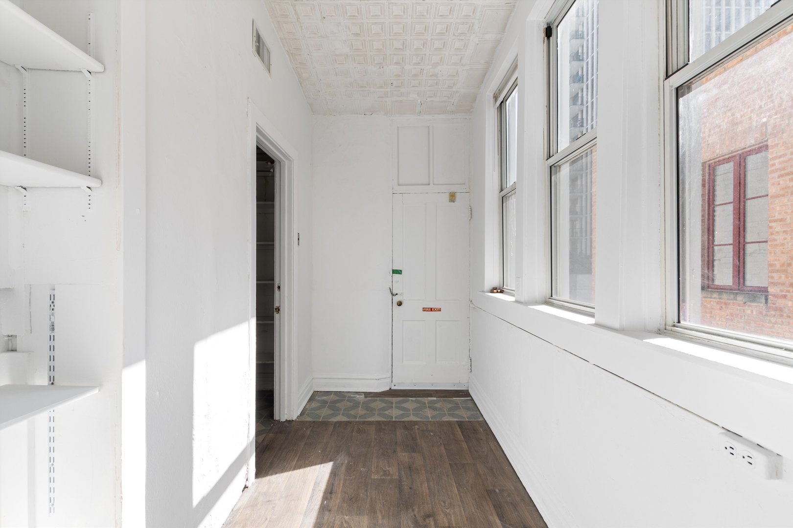 1239 North Dearborn Street Chicago, IL 60610 - Photo 15 of 30 a view of a hallway with wooden floor and staircase
