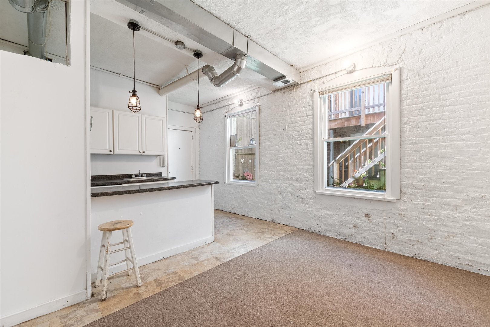 1239 North Dearborn Street Chicago, IL 60610 - Photo 19 of 30 a view of a kitchen with wooden floor and a window