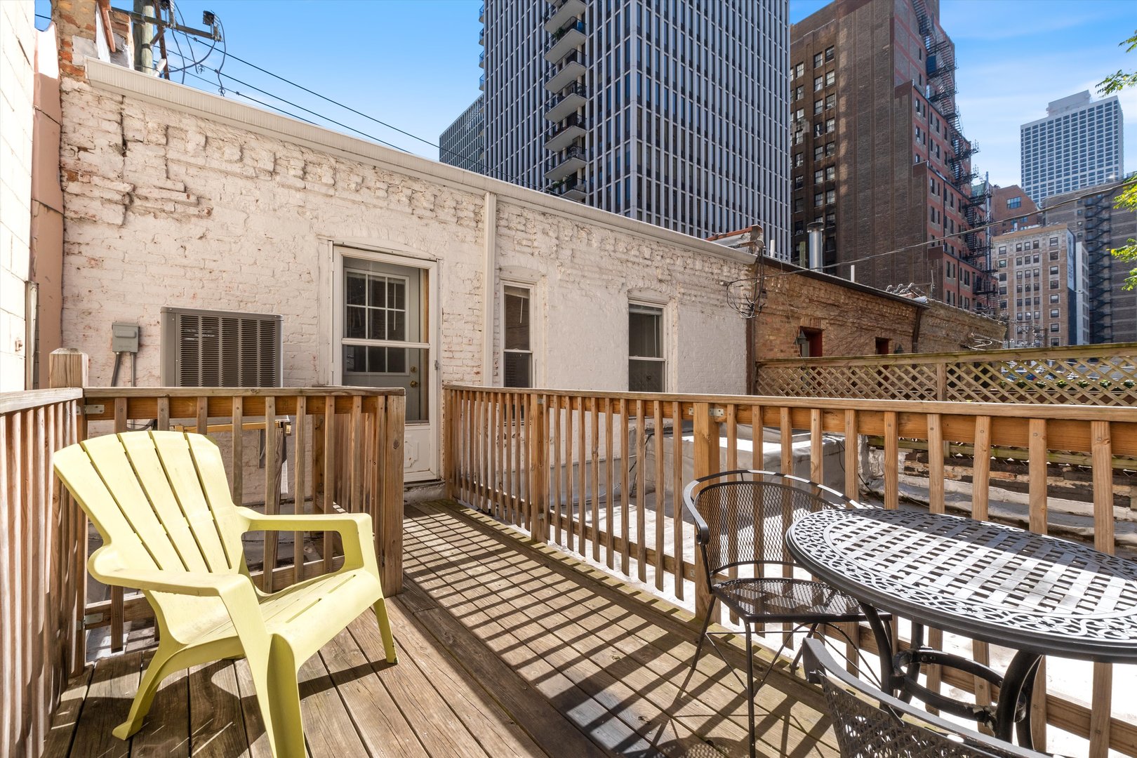 1239 North Dearborn Street Chicago, IL 60610 - Photo 22 of 30 a view of a patio with a table and chairs