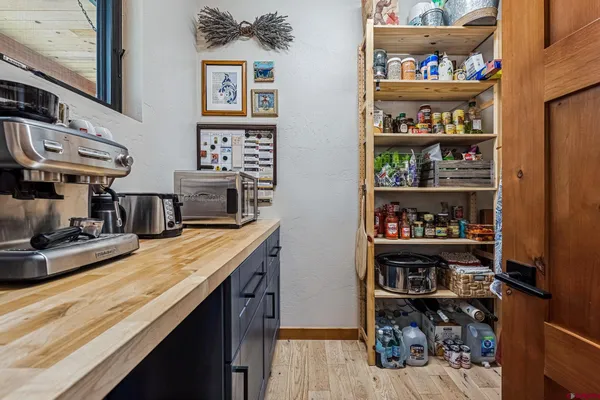a front view of a house with a yard and sitting area