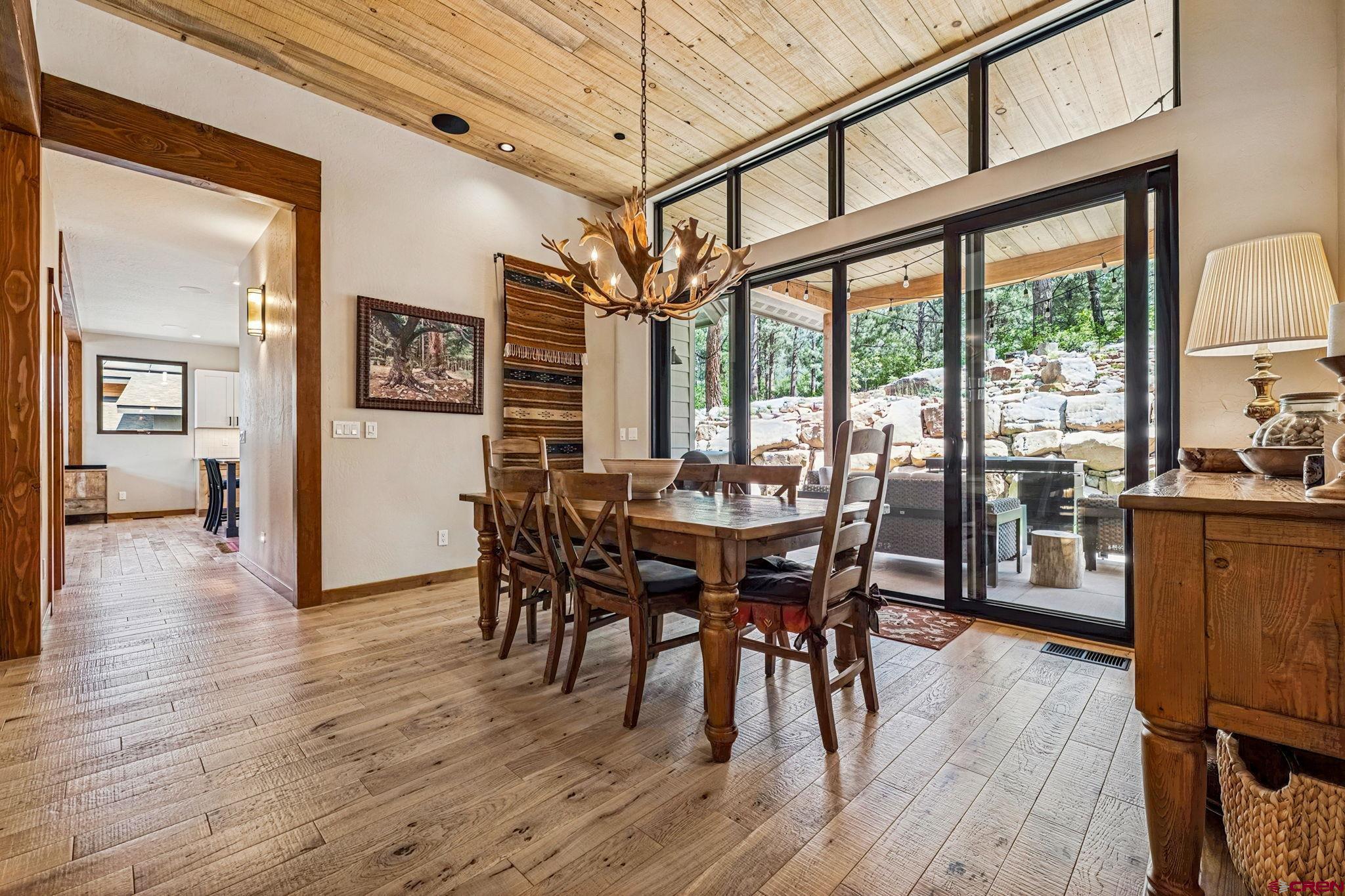 1022 Twin Buttes Avenue Durango, CO 81301 - Photo 12 of 45 a view of a dining room with furniture window and wooden floor