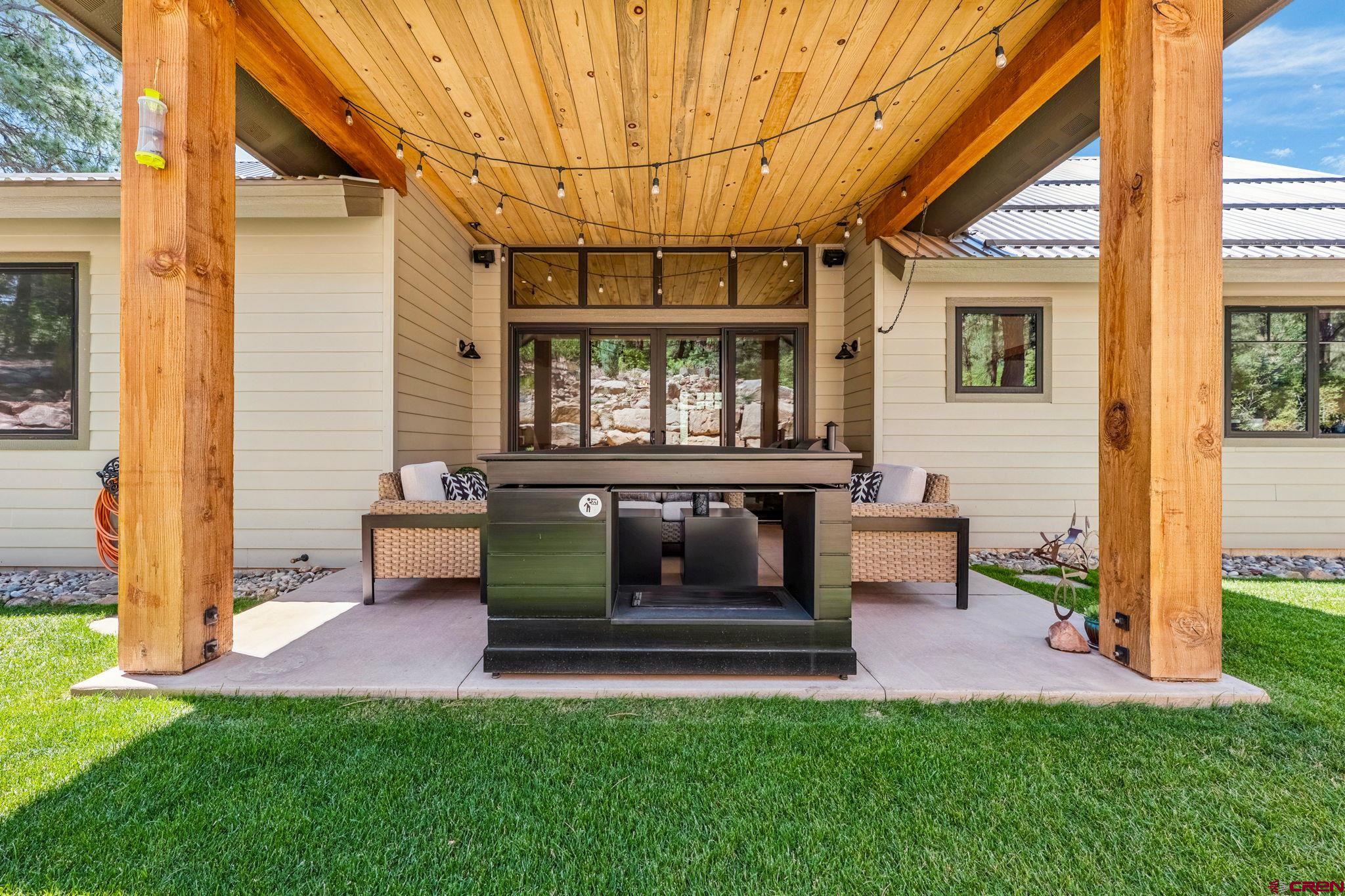 1022 Twin Buttes Avenue Durango, CO 81301 - Photo 13 of 45 a front view of a house with a yard and sitting area