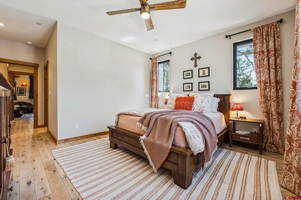 a bedroom with a bed and a table in it