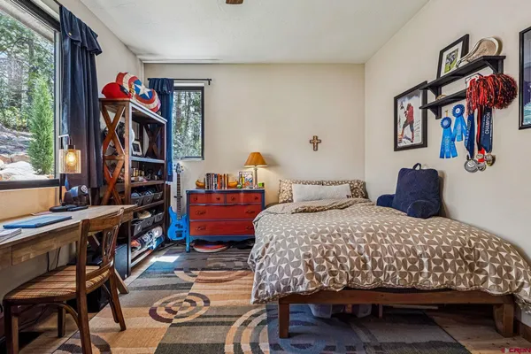 a view of a workspace with furniture and bedroom