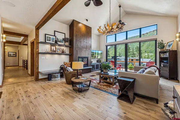 a living room with furniture and a fireplace