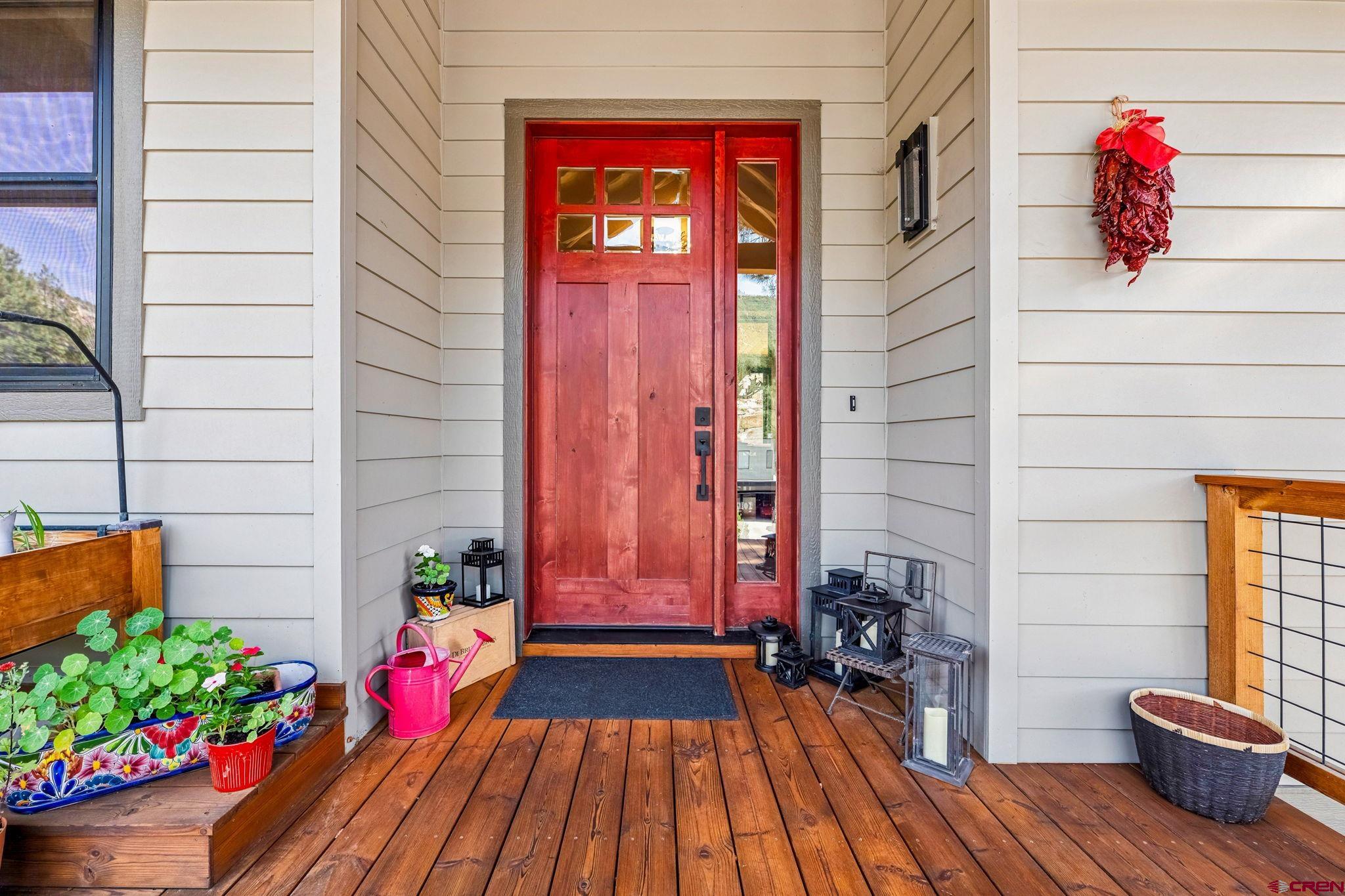 1022 Twin Buttes Avenue Durango, CO 81301 - Photo 38 of 45 a view of front door with wooden floor and potted plant