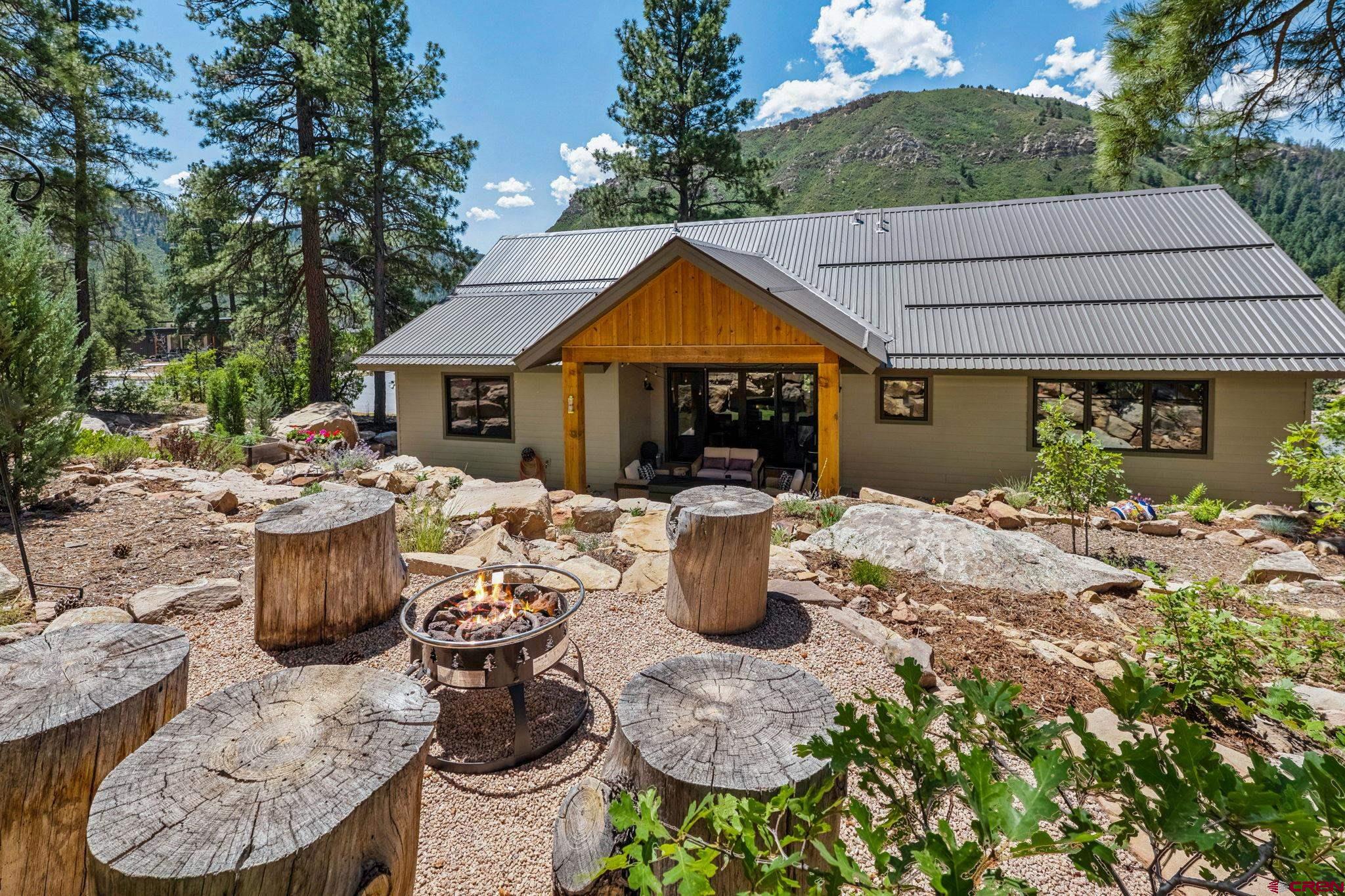 1022 Twin Buttes Avenue Durango, CO 81301 - Photo 41 of 45 a view of a patio with couches chairs and potted plants