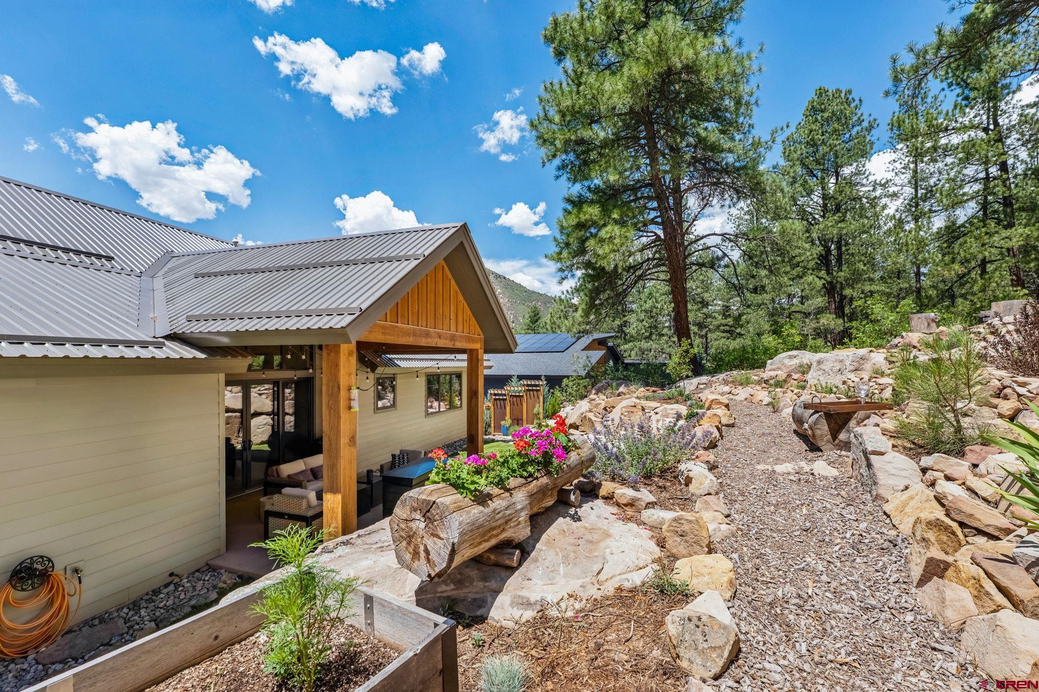 1022 Twin Buttes Avenue Durango, CO 81301 - Photo 42 of 45 a front view of a house with a yard