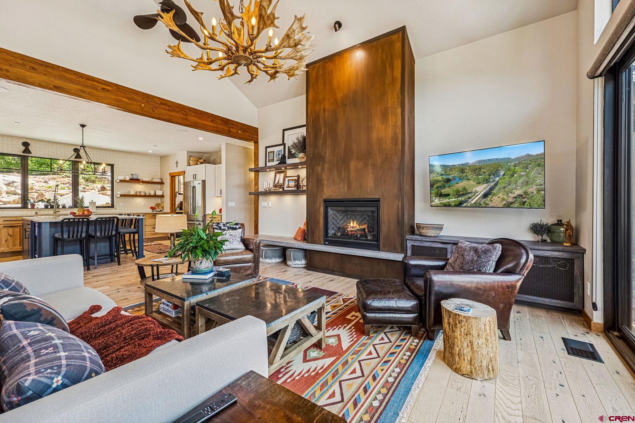 1022 Twin Buttes Avenue Durango, CO 81301 - Photo 9 of 45 a living room with furniture and a fireplace