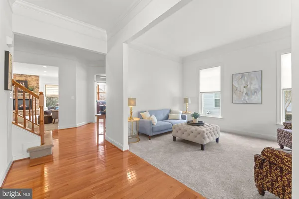 a living room with furniture and large windows