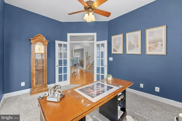 a kitchen with stainless steel appliances granite countertop a sink a counter top space and a large window