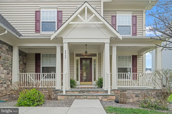 a view of an entryway with wooden floor and a livingroom view