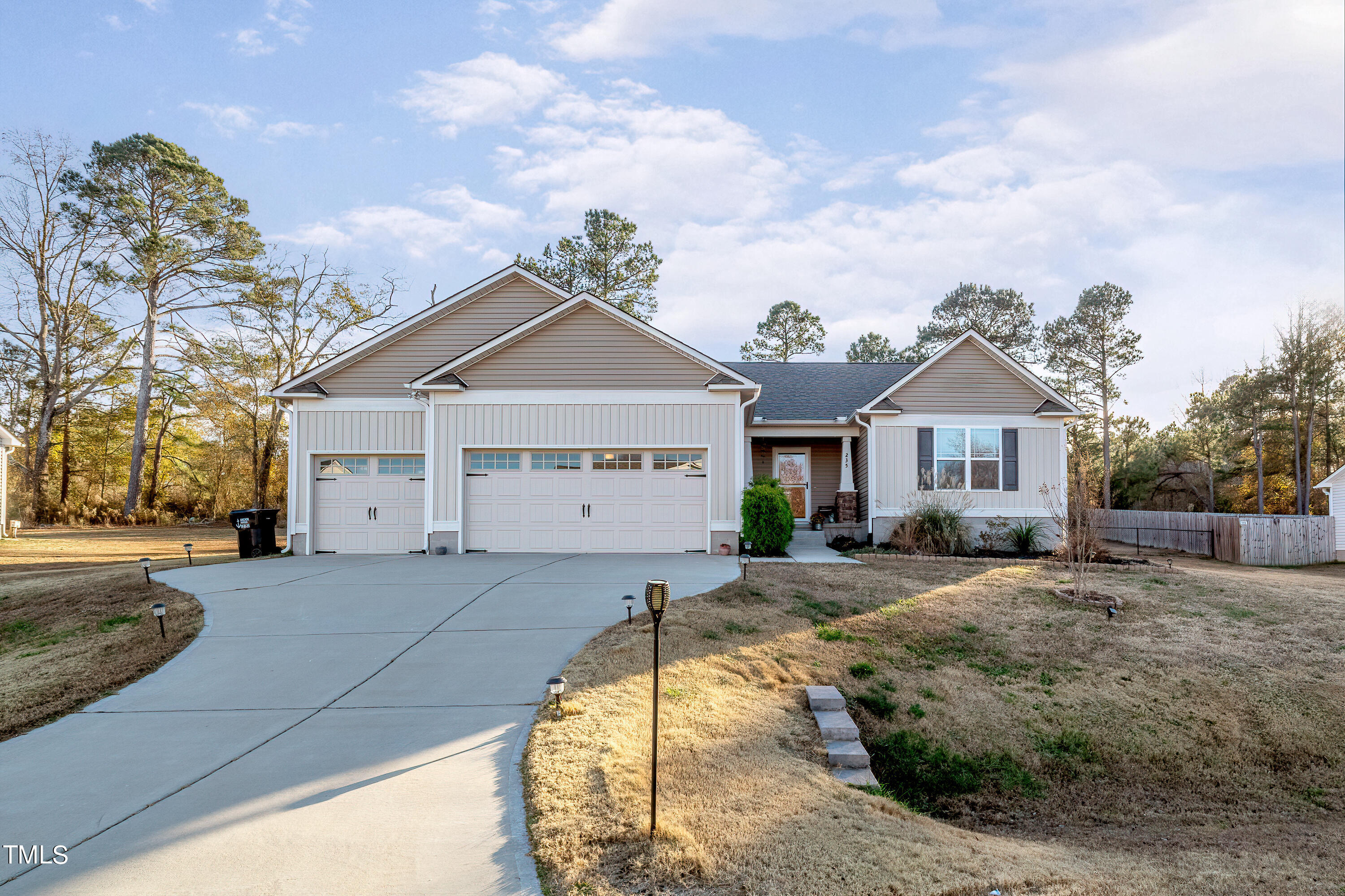235 Highcroft Circle Benson, NC 27504 - Photo 1 of 25 a front view of a house with a yard