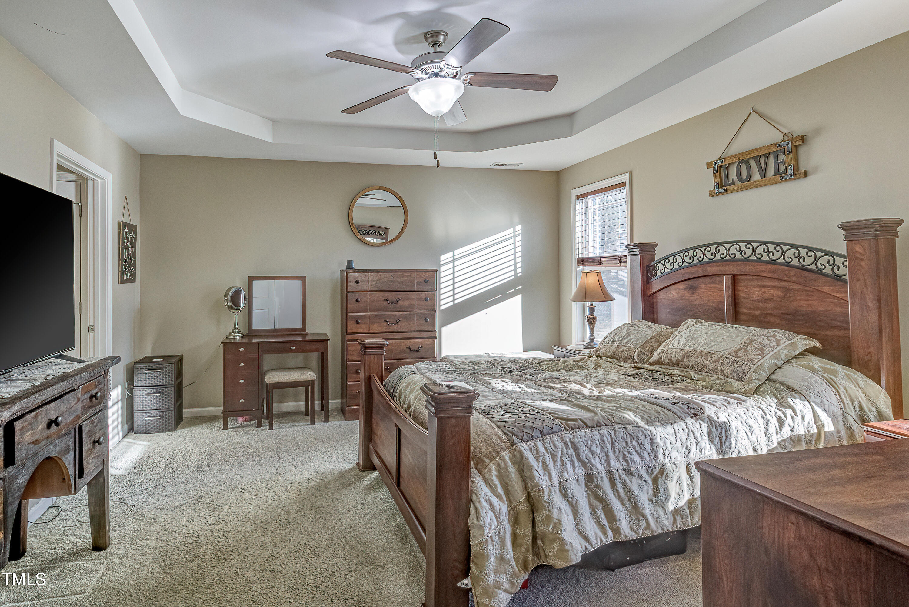 235 Highcroft Circle Benson, NC 27504 - Photo 14 of 25 a bedroom with a bed and a flat screen tv