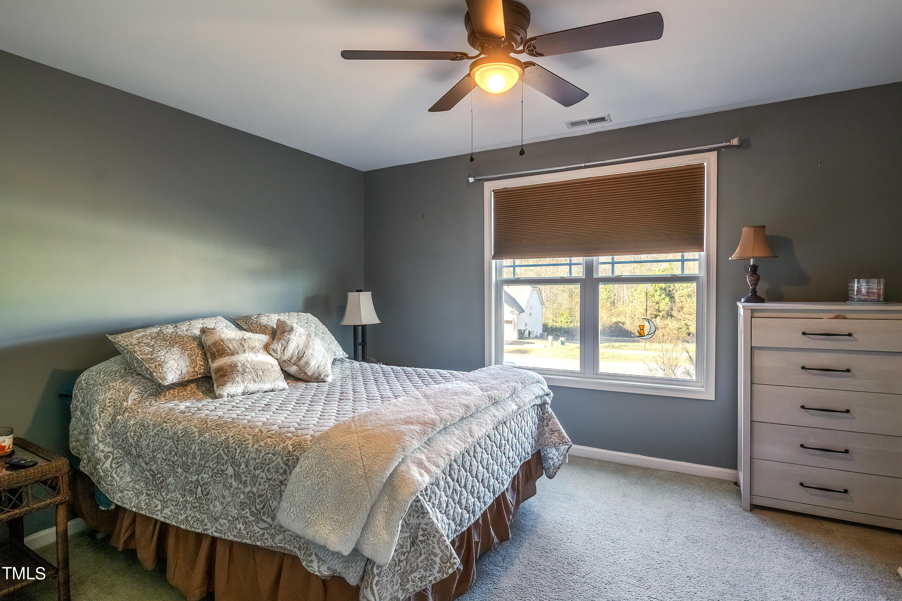 235 Highcroft Circle Benson, NC 27504 - Photo 19 of 25 a bedroom with a bed and a window