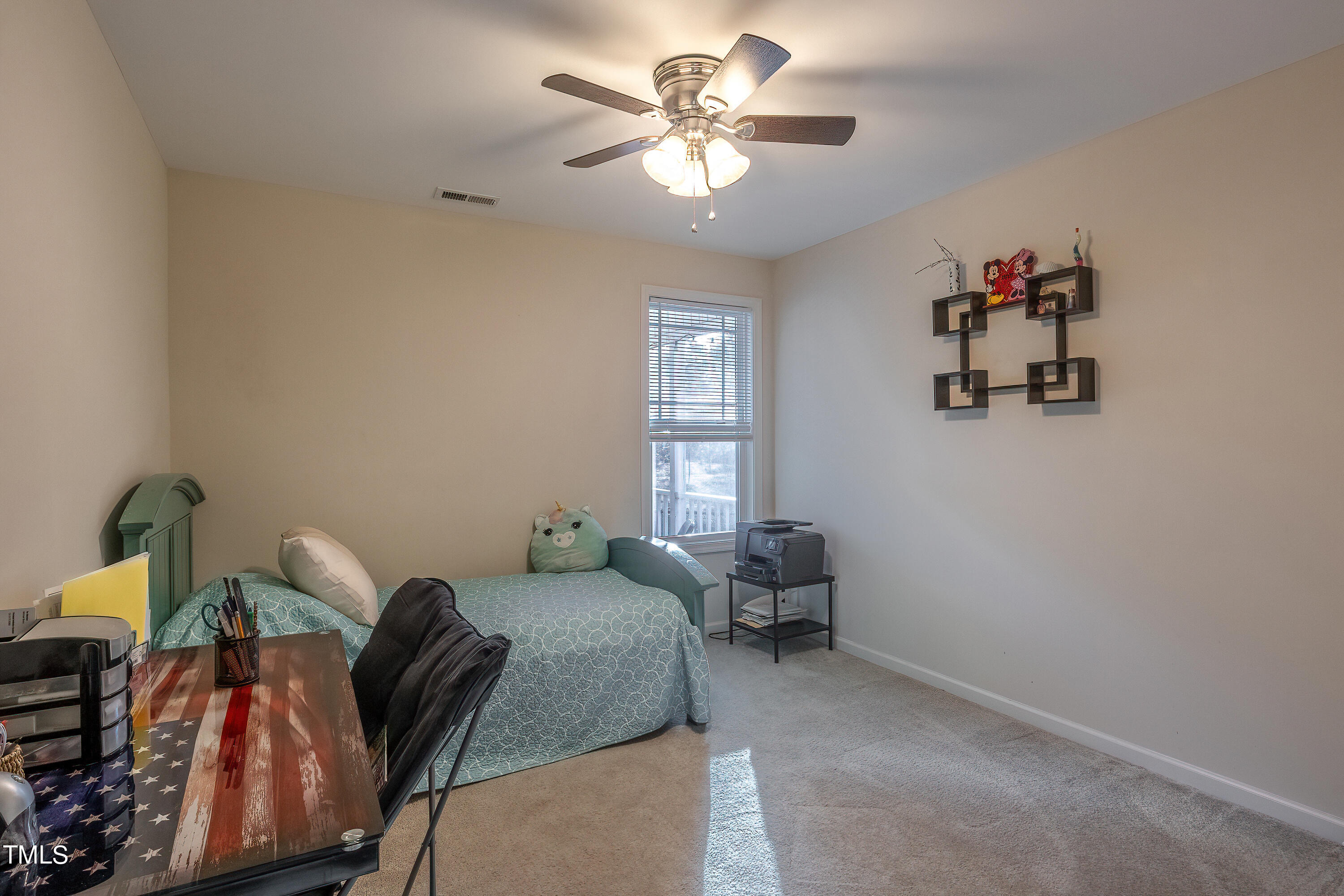 235 Highcroft Circle Benson, NC 27504 - Photo 21 of 25 a bedroom with furniture and a window