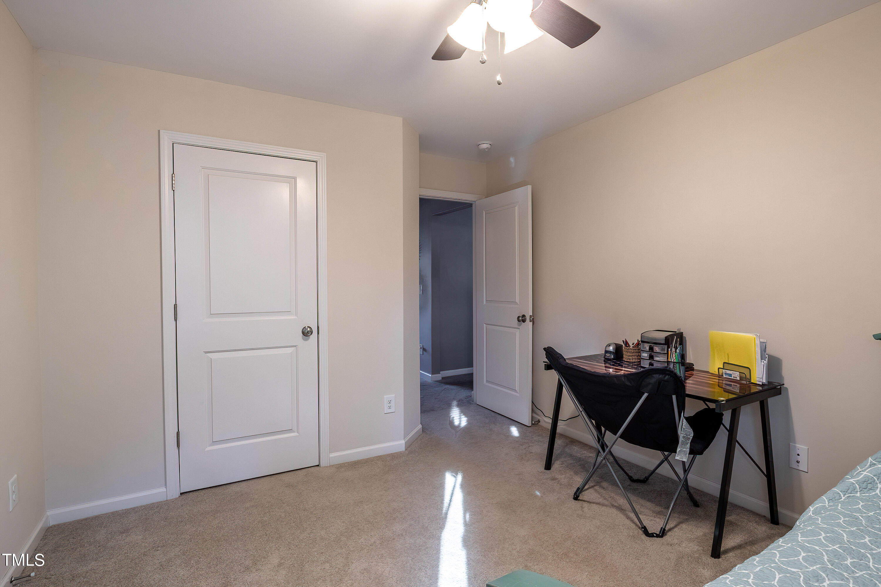 235 Highcroft Circle Benson, NC 27504 - Photo 22 of 25 a view of a workspace with furniture and a chandelier fan