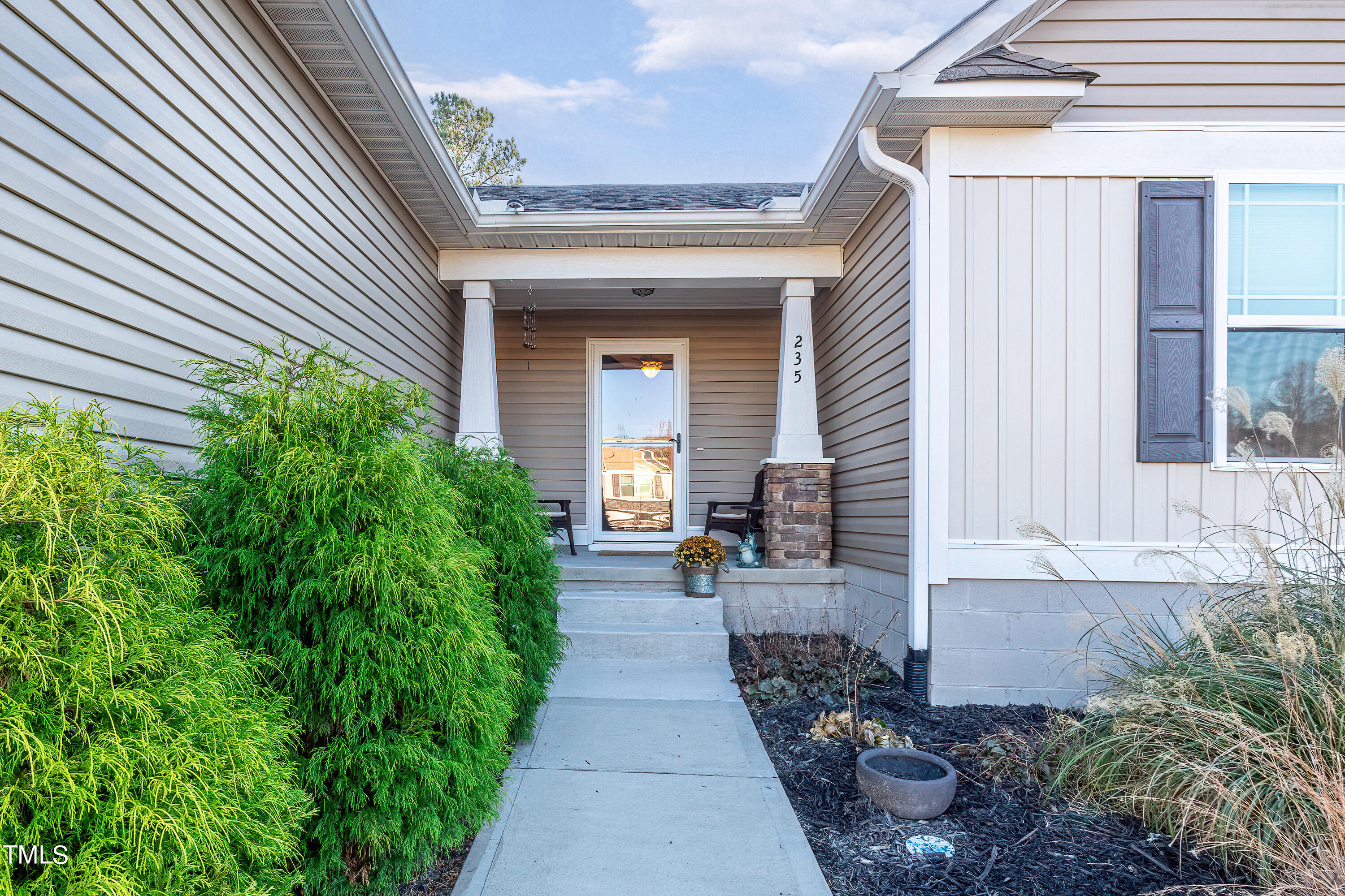 235 Highcroft Circle Benson, NC 27504 - Photo 5 of 25 a view of a house with potted plants