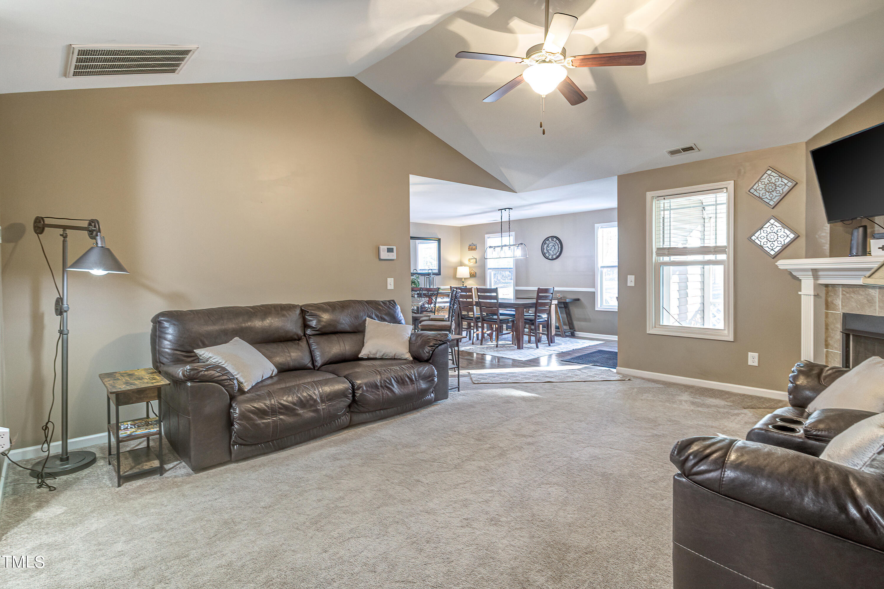 235 Highcroft Circle Benson, NC 27504 - Photo 7 of 25 a living room with furniture and a large window