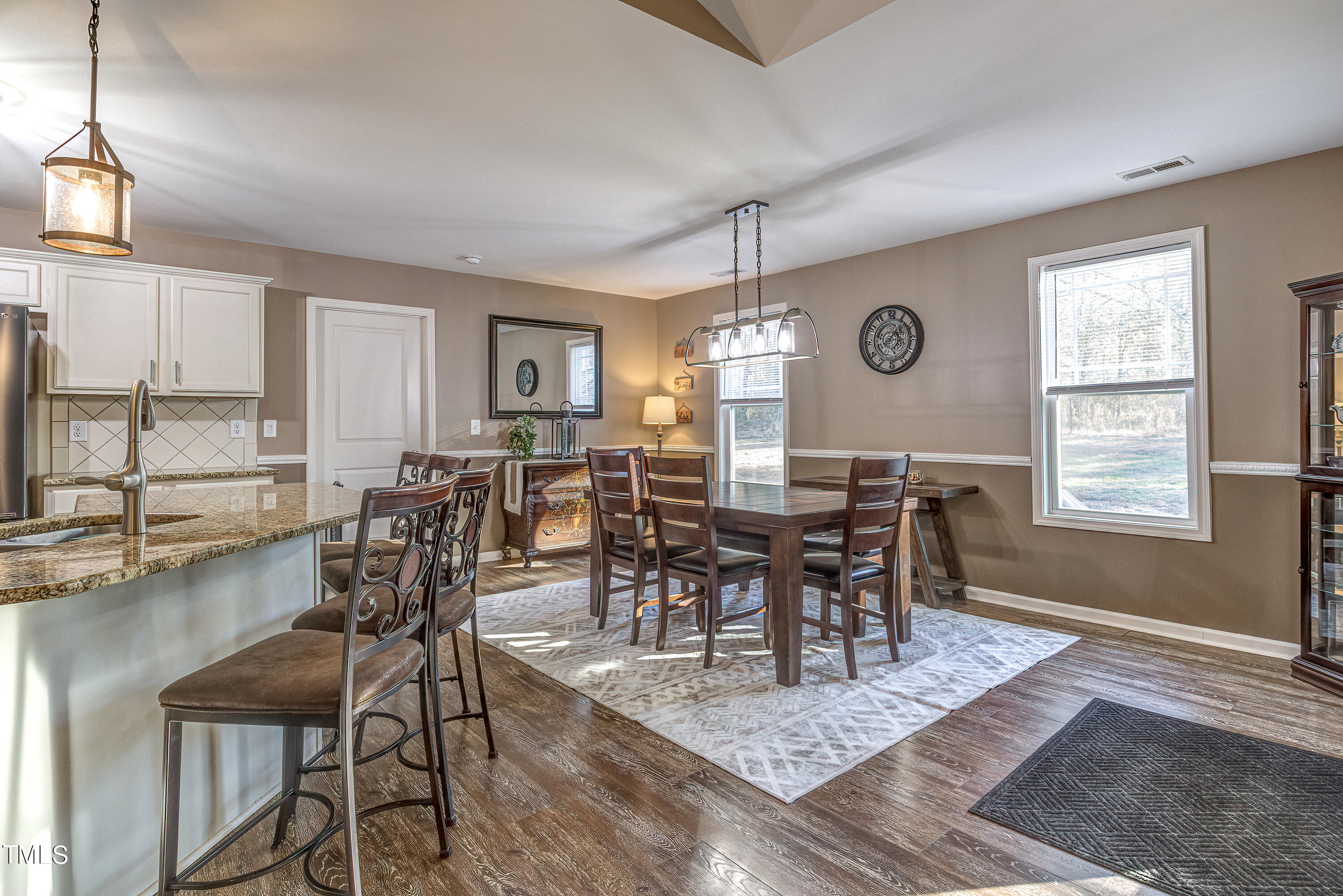 235 Highcroft Circle Benson, NC 27504 - Photo 9 of 25 a view of a dining room with furniture and window