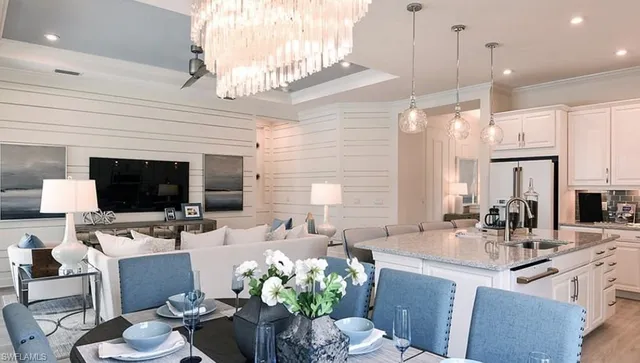 a view of a workspace with furniture and window