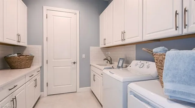 a bathroom with a sink a mirror and a shower curtain