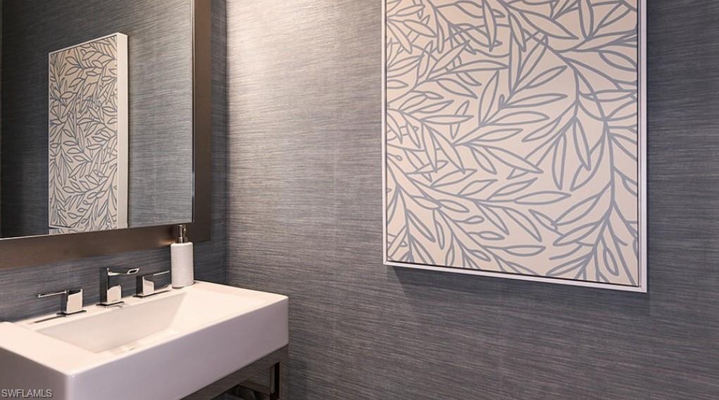 12701 Bellissimo Fort Myers, FL 33913 - Photo 17 of 34 a bathroom with a sink a mirror and a shower curtain