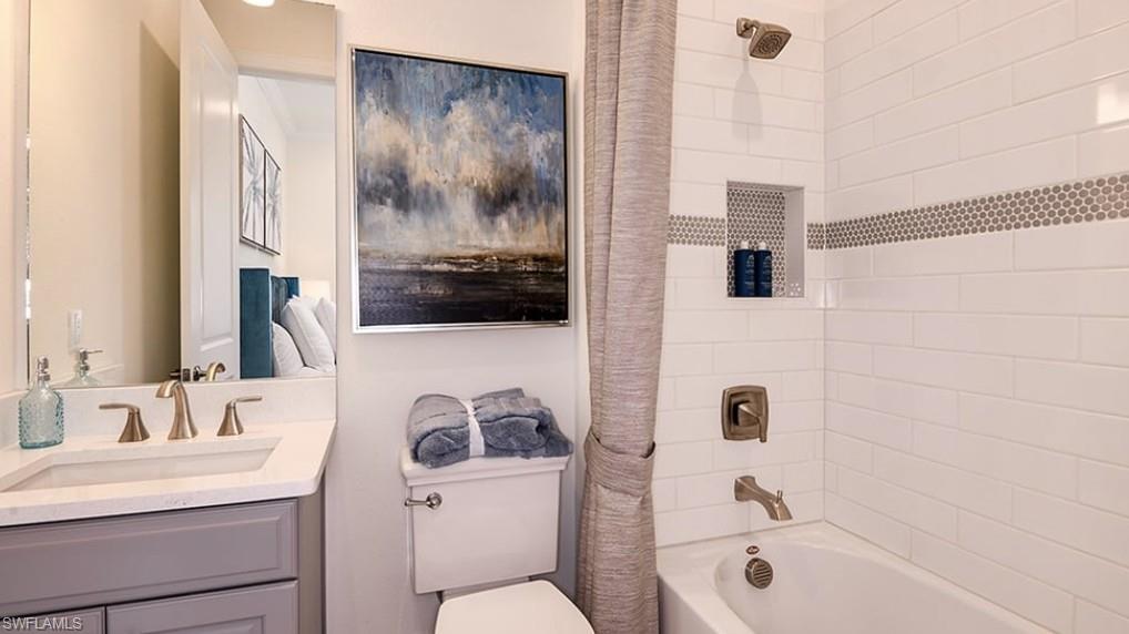 12701 Bellissimo Fort Myers, FL 33913 - Photo 19 of 34 a bathroom with a sink a toilet and shower