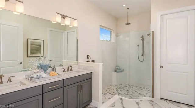 a kitchen with granite countertop a stove a sink and a microwave