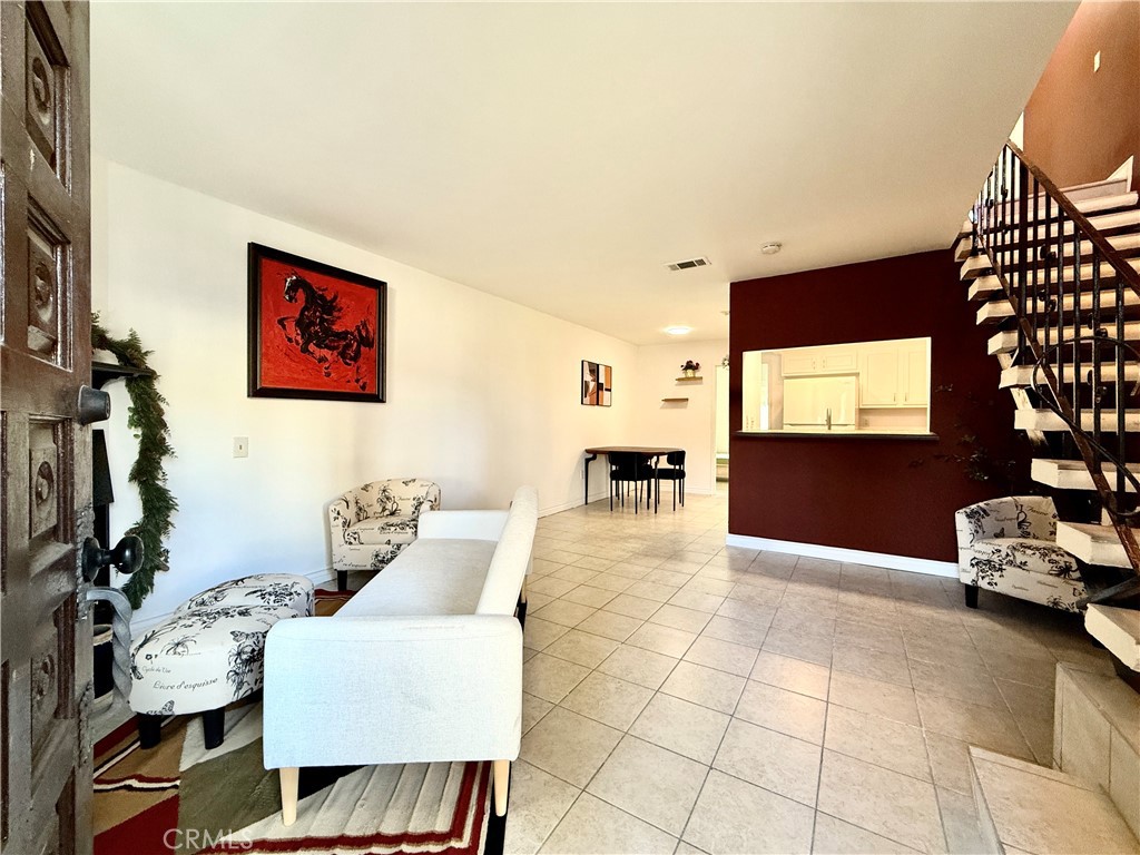 1415 Everton Place Riverside, CA 92507 - Photo 2 of 24 a living room with furniture a flat screen tv and a window