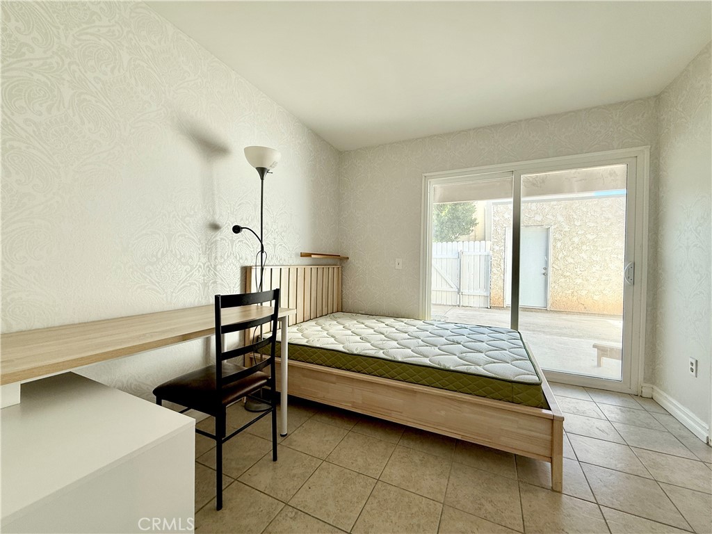 1415 Everton Place Riverside, CA 92507 - Photo 10 of 24 a bedroom with a bed and a window