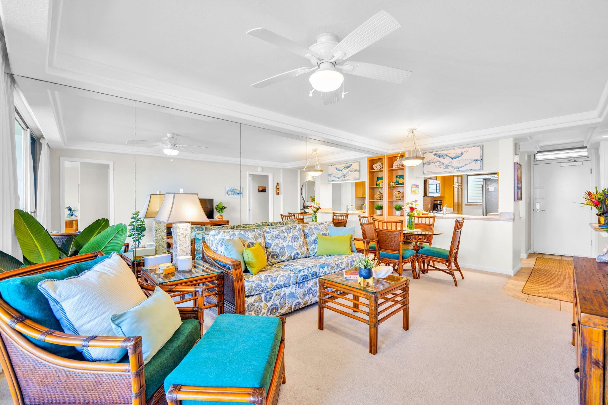 2430 South Kihei Road, Unit 515 Kihei, HI 96753 - Photo 12 of 50 a living room with furniture a rug and a ceiling fan
